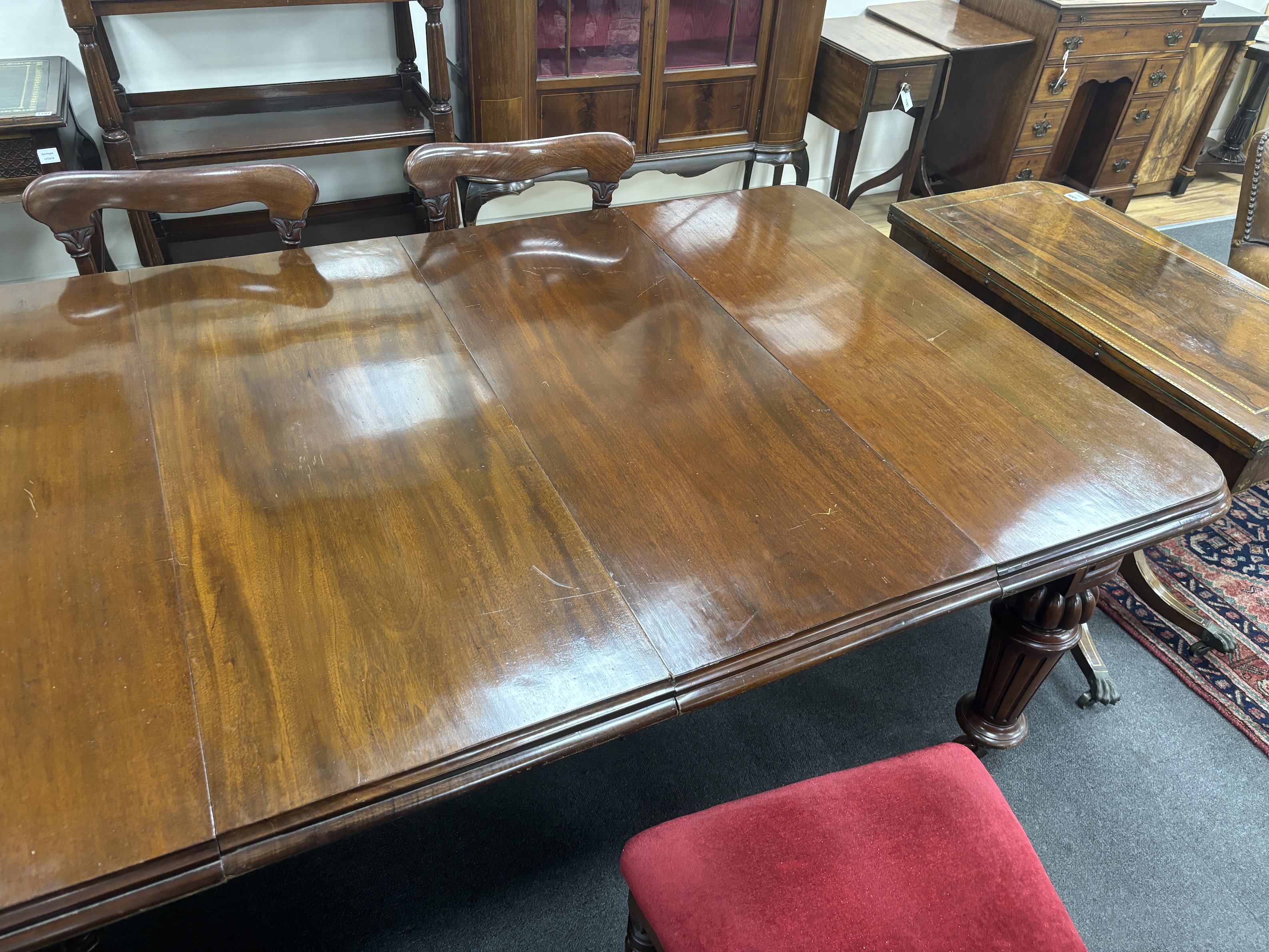 A Victorian mahogany extending dining table, 232cm extended, two spare leaves, depth 118cm, height 72cm together with a set of eight early Victorian mahogany dining chairs